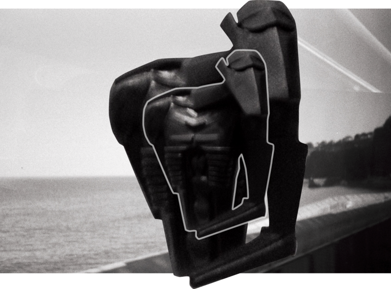 Torso in metal along the coast