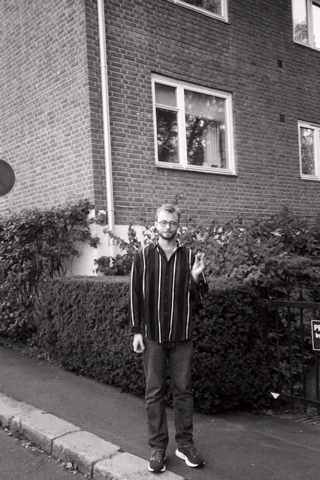 Tobias holding a pear